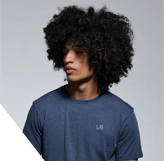 Male model wearing The Ultimate Boon T-Shirt in dark blue